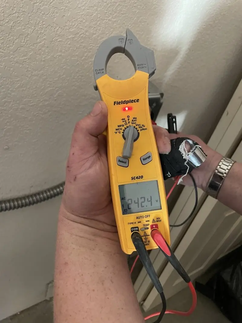 Voltage testing with clamp meter during Outlet Installation in Chillicothe